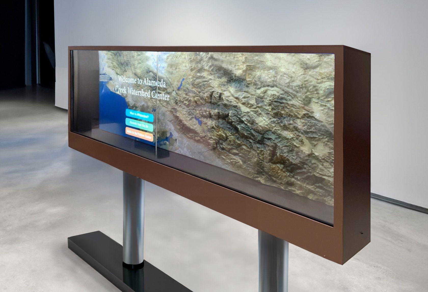 SkyBox transparent dimensional video wall showing the Alameda Creek Watershed topographic map